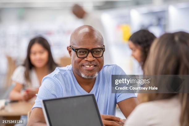 senior man attends meeting or interview during job training event - job fair stock pictures, royalty-free photos & images