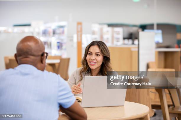 coworkers discuss ideas and brainstorm while attending dei training event - job fair stock pictures, royalty-free photos & images