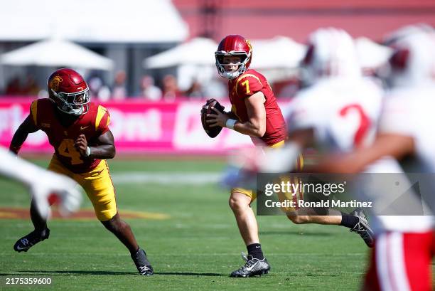 Miller Moss of the USC Trojans throws against the Wisconsin Badgers in the second half at United Airlines Field at the Los Angeles Memorial Coliseum...
