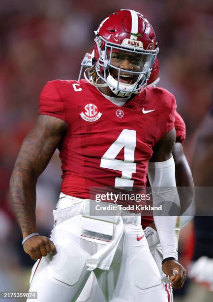 Jalen Milroe of the Alabama Crimson Tide celebrates after scoring a rushing touchdown against the Georgia Bulldogs during the first quarter at...