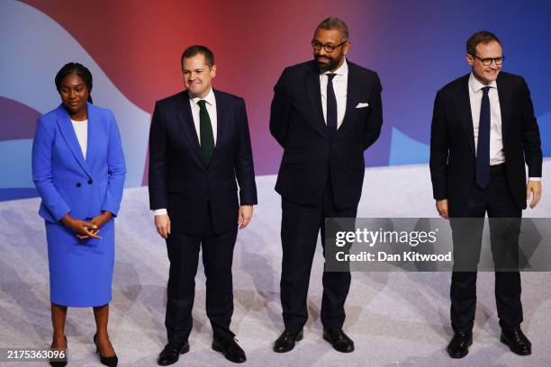 Conservative leadership contenders Kemi Badenoch, Robert Jenrick, James Cleverly and Tom Tugendhat acknowledge the audience after they delivered...