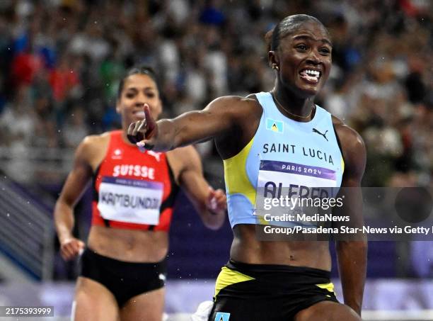 Paris, Fr Julien Alfred of Saint Lucia reacts as she wins gold and the women's 100m final during track and field at Stade de France during the Paris...