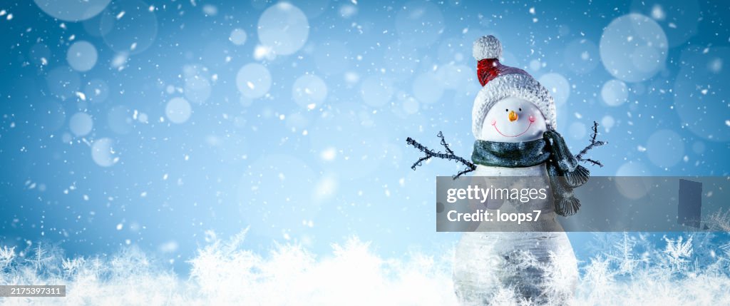 Snowman in Winter Landscape