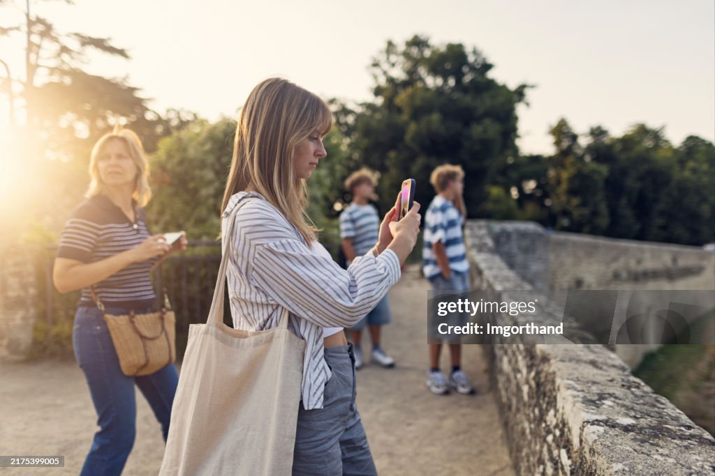 Family looking at view in Dinan, Brittany, France.
