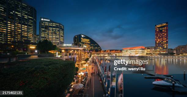 early evening view of darling harbour - darling harbour stock pictures, royalty-free photos & images