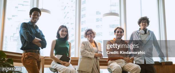 group portrait of multi-ethnic business man and woman, smile and look at camera in modern corporate office. happy businesspeople, people diversity at work, colleague coworker lifestyle concept - smart casual stock pictures, royalty-free photos & images