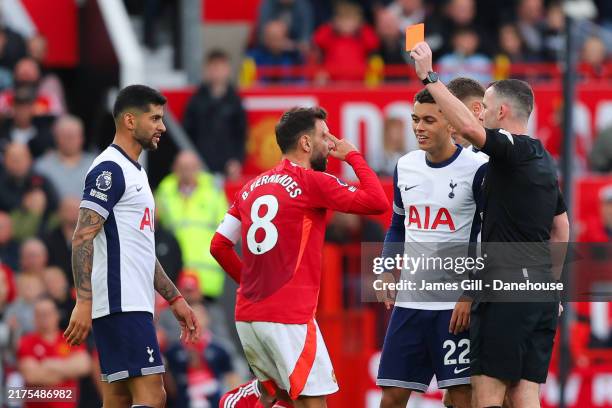 Bruno Fernandes of Manchester United is shown a red card by referee Chris Kavanagh during the Premier League match between Manchester United FC and...