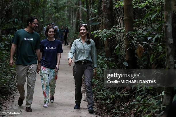 Queen Mary of Denmark walks on a trail with Musa director general Filippo Stampanoni and archaeologist Meliam Gaspar during a visit to the Museum of...