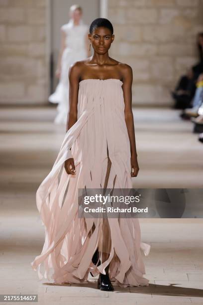 Model walks the runway during the Akris Paris Womenswear Spring-Summer 2025 show at College des Bernardins as part of Paris Fashion Week on September...