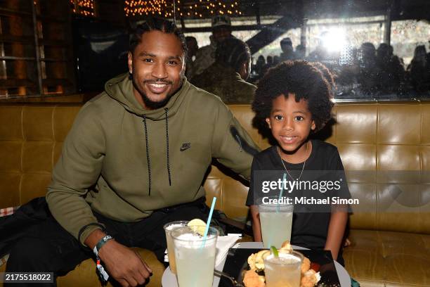 Trey Songz and son Noah Neverson at a game between the New York Jets and Denver Broncos at MetLife Stadium on September 29, 2024 in East Rutherford,...