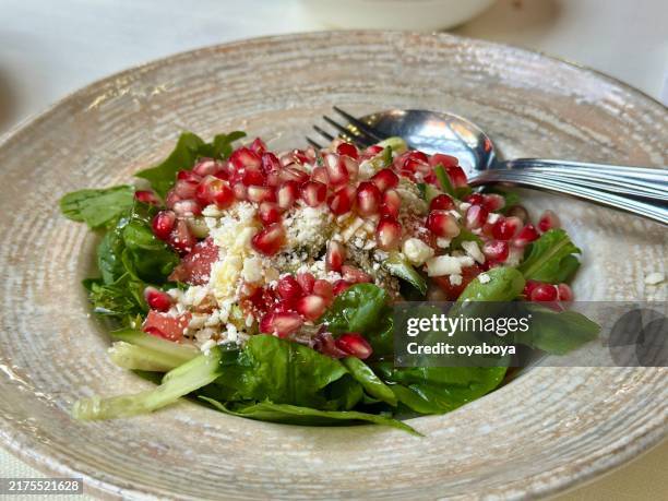 pomegranate arugula salad - pomegranate seed stock pictures, royalty-free photos & images