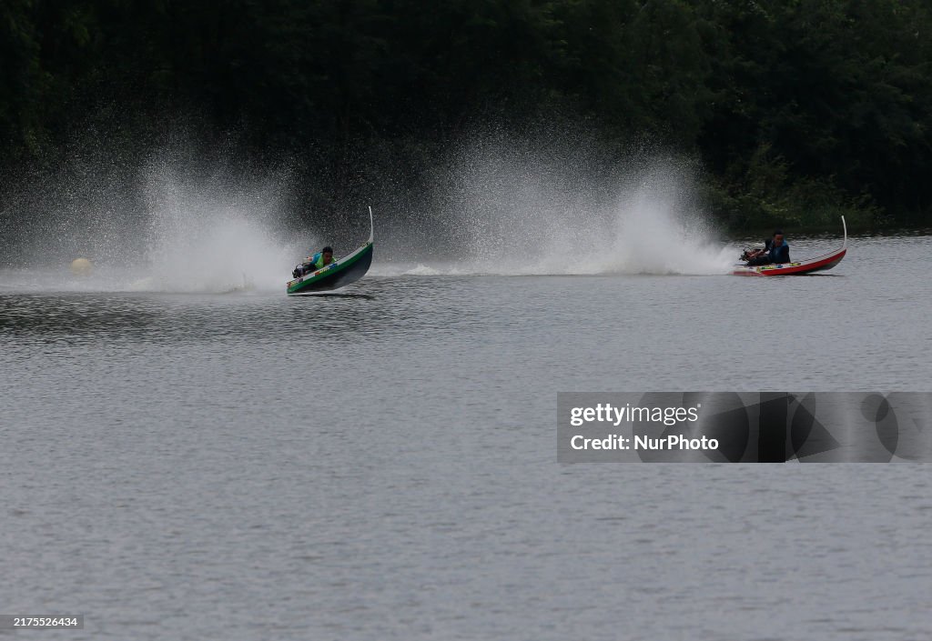 Rider Compete During The Annual ''Sword-Headed Boat Racing Festival