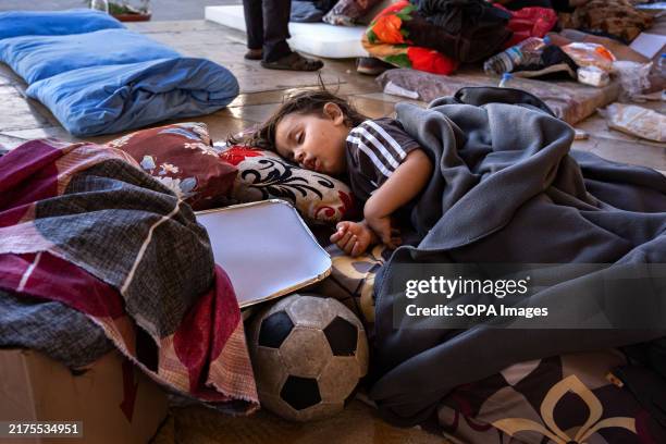 Displaced boy sleeps on blankets laid on the floor of the Grand Mosque in Martyrs' Square. With more than 1 million displaced from the south, Lebanon...