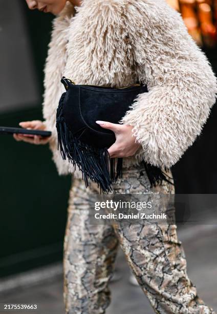 Marie Gaguech is seen wearing a faux fur jacket, white shirt, animal print leggings the Isabel Marant show during Womenswear Spring/Summer2025 as...