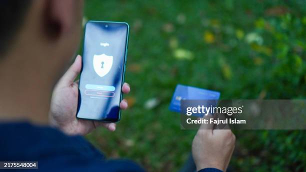 paying with credit card online with smartphone - shopaholic stock pictures, royalty-free photos & images