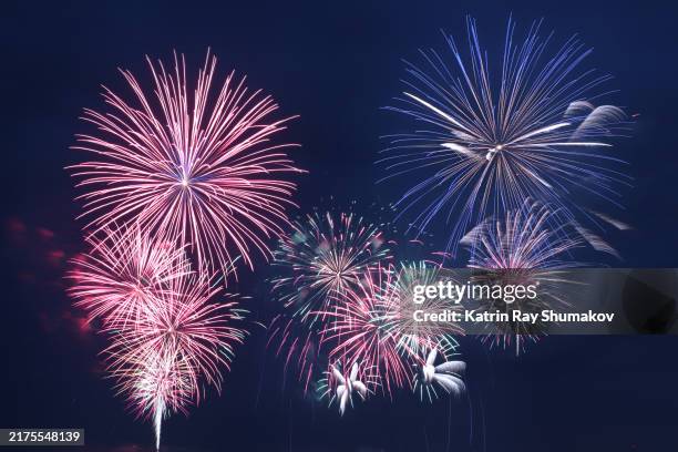 fantastic fireworks in deep blue skies - fireworks stock pictures, royalty-free photos & images