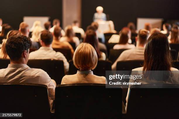 back view of crowd of people on a seminar in convention center. - pressrum bildbanksfoton och bilder