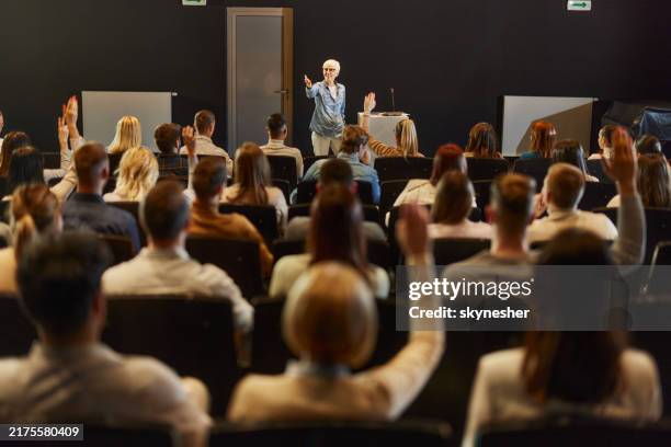 engaging seminar at convention center! - public speaker stock pictures, royalty-free photos & images