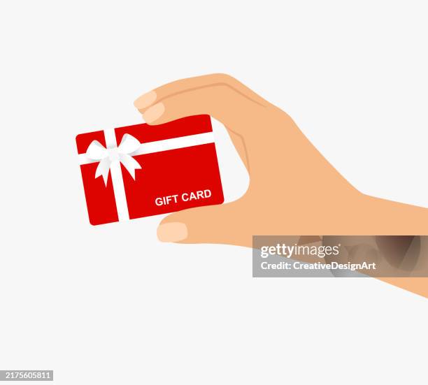 hand holding red gift card with white ribbon and bow. gift card, coupon or voucher - loyalty card stock illustrations