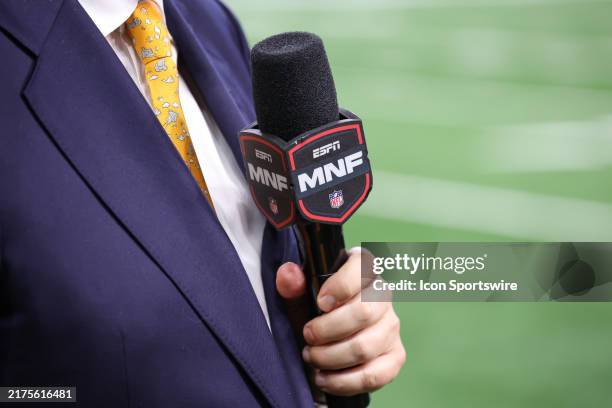 Detail view of the ESPN Monday Night Football logo block on a sideline reporter's microphone is seen during the third quarter of an NFL Monday Night...
