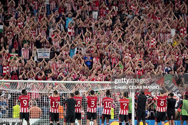 Athletic Bilbao's players celebrate with supporters at the end of the UEFA Europa League 1st round day 2 between Athletic Club Bilbao and AZ Alkmaar...