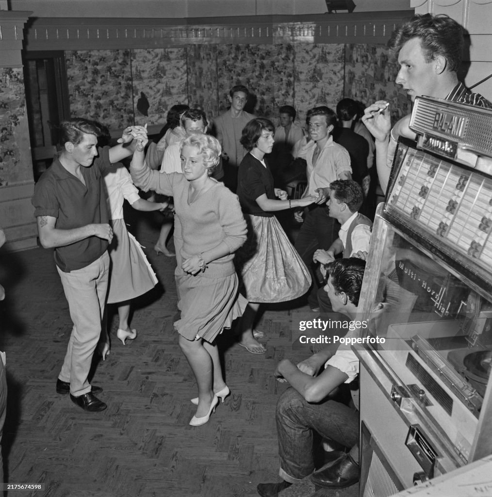 Jiving Country Teenagers and young men and women jiving and dancing in a club to ...
