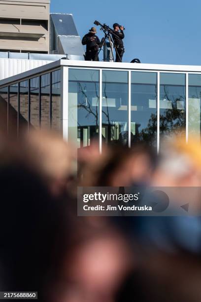 Security team overlooks supporters of Vice President and Democratic Presidential nominee Kamala Harris, listening to her speak during a rally at...