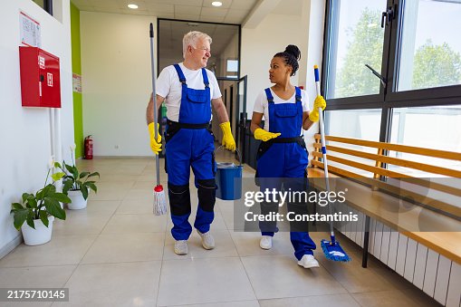 Janitors with tools in hands Janitors with tools in hands