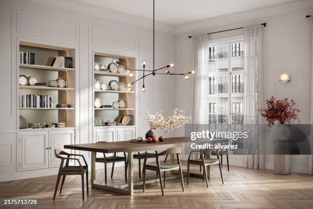 dining room with open shelving and modern lighting - eetkamer stockfoto's en -beelden