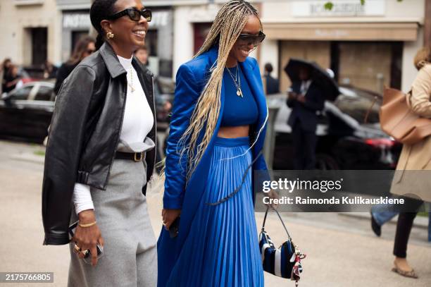 Guest wears grey skirt with a belt, white shirt and black leather jacket and Shiona Turini wears blue crop top, blue pleated skirt and a jacket...