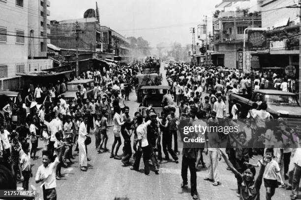 Soldiers of the FNL are cheered by the inhabitants of Saigon, during the fall of Saigon on April 30, 1975. Saigon was then called Ho Chi Minh-Ville...