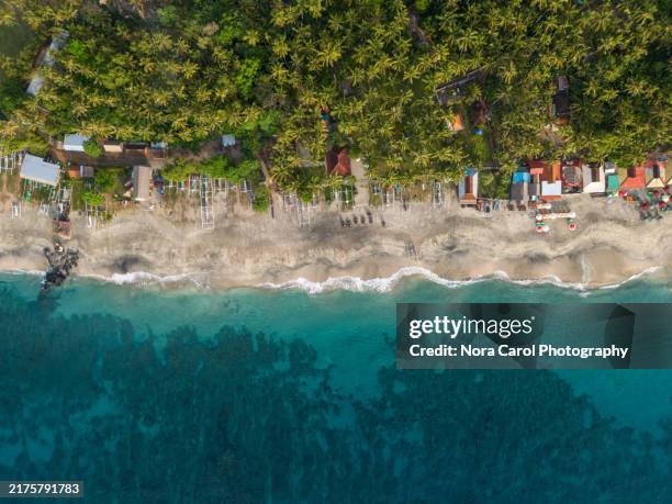 drone point of view of virgin beach pantai pasir putih, karangasem, bali - indian ocean stock pictures, royalty-free photos & images