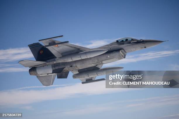 This photograph taken aboard a French Air Force Airbus A330 MRTT , over Greek territorial waters, October 4, 2024 shows a Romanian Air Force F-16...