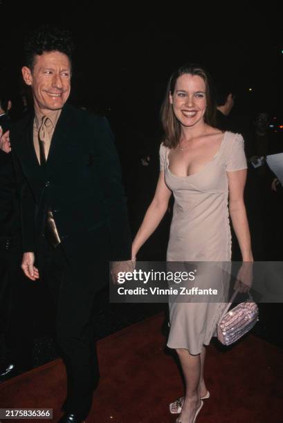 American country singer Lyle Lovett and girlfriend April Kimble arriving for the premiere of 'Play it to the Bone' at the El Capitan Theatre in Los...