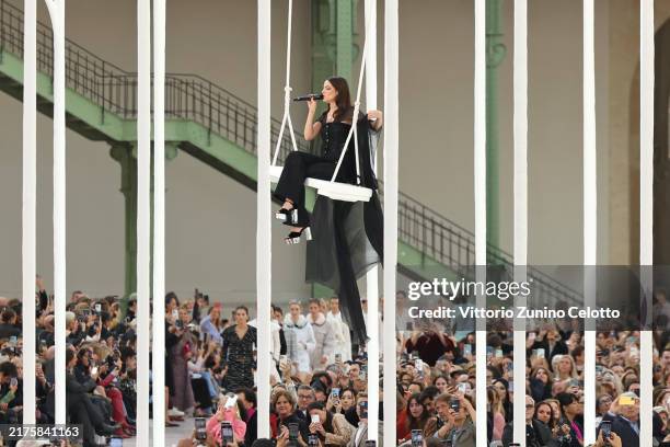 Ambassador for Chanel, Riley Keough performs on the runway during the Chanel Paris Womenswear Spring-Summer 2025 show as part of Paris Fashion Week...