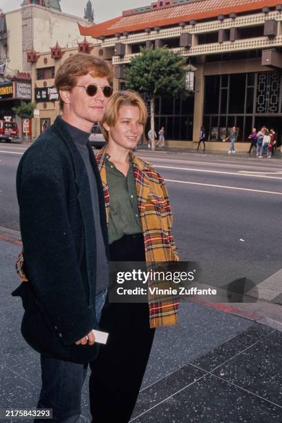 American actors Eric Stoltz and Bridget Fonda attend the Hollywood premiere of 'Beauty and the Beast' held at the El Capitan Theatre in Los Angeles,...