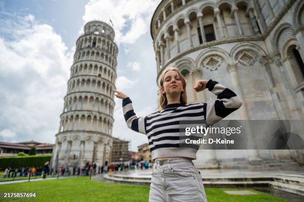 girl holding leaning tower with her finger - pisa stock pictures, royalty-free photos & images