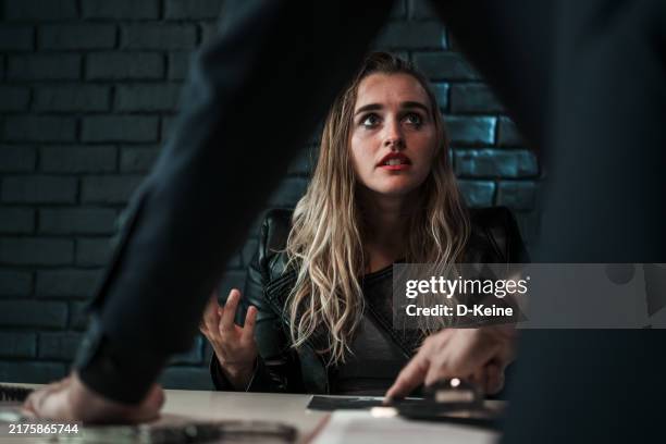 arrested woman - interrogatorio foto e immagini stock