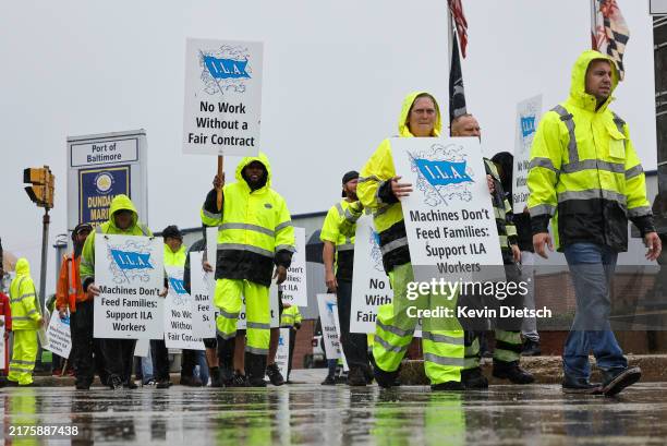 Longshoremen with the International Longshoremen’s Association and their supporters picket outside of the Dundalk Marine Terminal at the Port of...