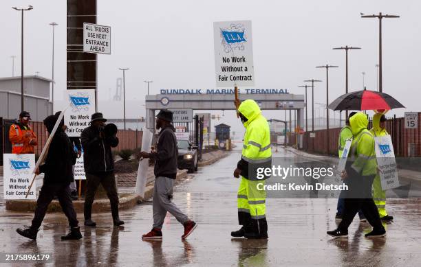 Longshoremen with the International Longshoremen’s Association and their supporters picket outside of the Dundalk Marine Terminal at the Port of...
