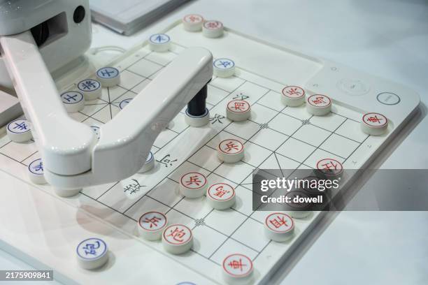 playing chinese chess with robots - robot playing chess stock pictures, royalty-free photos & images