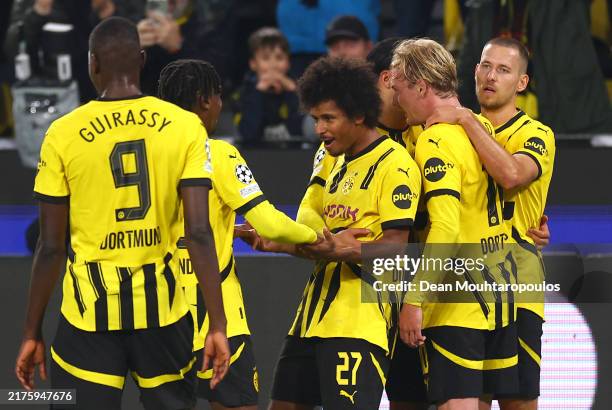 Karim Adeyemi of Borussia Dortmund celebrates scoring his team's third goal with teammates during the UEFA Champions League 2024/25 League Phase MD6...