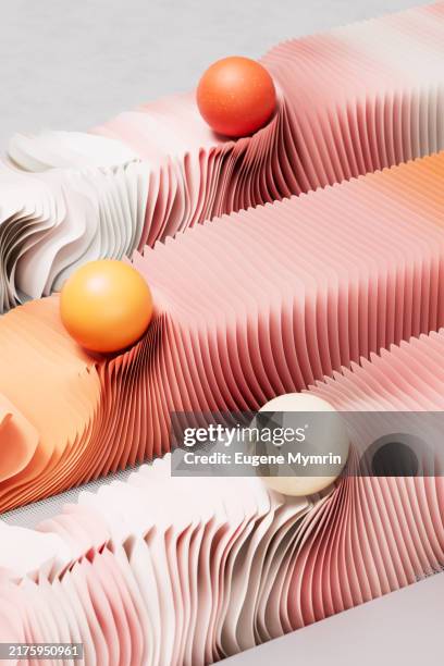 three parallel, flowing, wave-like structures and spherical objects. evolution and transformation. - peach color stock pictures, royalty-free photos & images