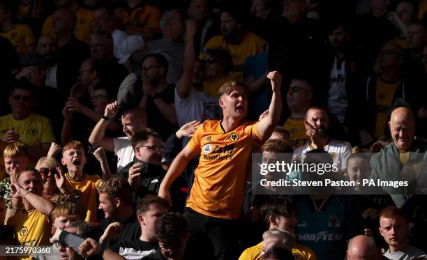 Wolverhampton Wanderers fans celebrate their equalising goal to make it 1-1 during the Premier League match at the Gtech Community Stadium, London....