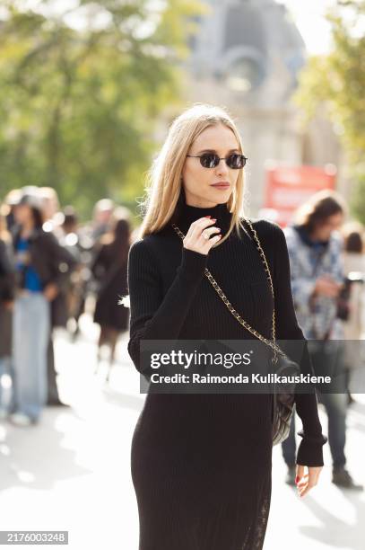 Pernille Teisbaek wears long black long sleeve, turtle neck maxi dress and sunglasses outside the Chanel show during Womenswear Spring/Summer 2025 as...