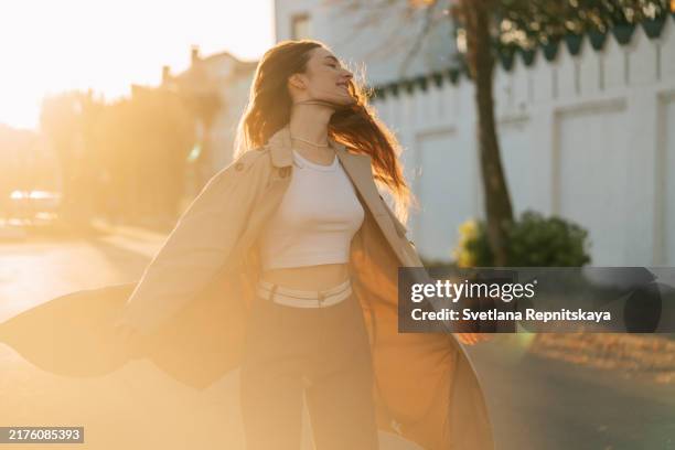 teenage girl in the rays of the evening sun on an autumn walk - armenian girl stock pictures, royalty-free photos & images