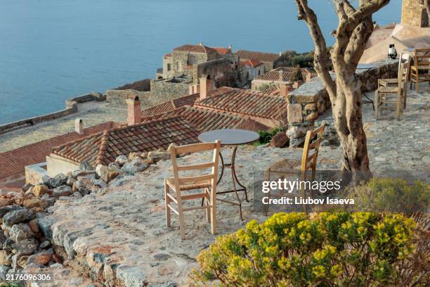 traditional greek cafe in monemvasia castle town, peloponnese, greece - greek style stock pictures, royalty-free photos & images
