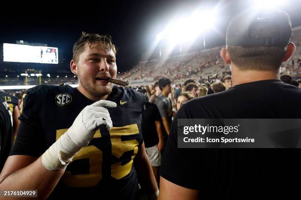 Vanderbilt Commodores offensive lineman Gunnar Hansen chews on a cigar following a game between the Vanderbilt Commodores and Alabama Crimson Tide,...