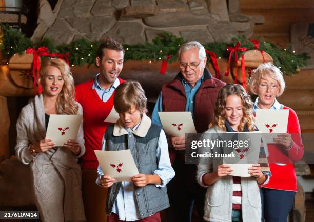 christmas carols - carol singer stock pictures, royalty-free photos & images