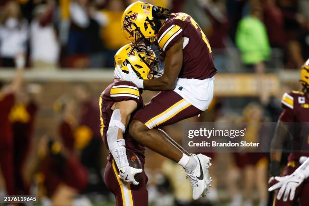 Koi Perich of the Minnesota Golden Gophers celebrates after an interception in the fourth quarter during a game against the USC Trojans at Huntington...